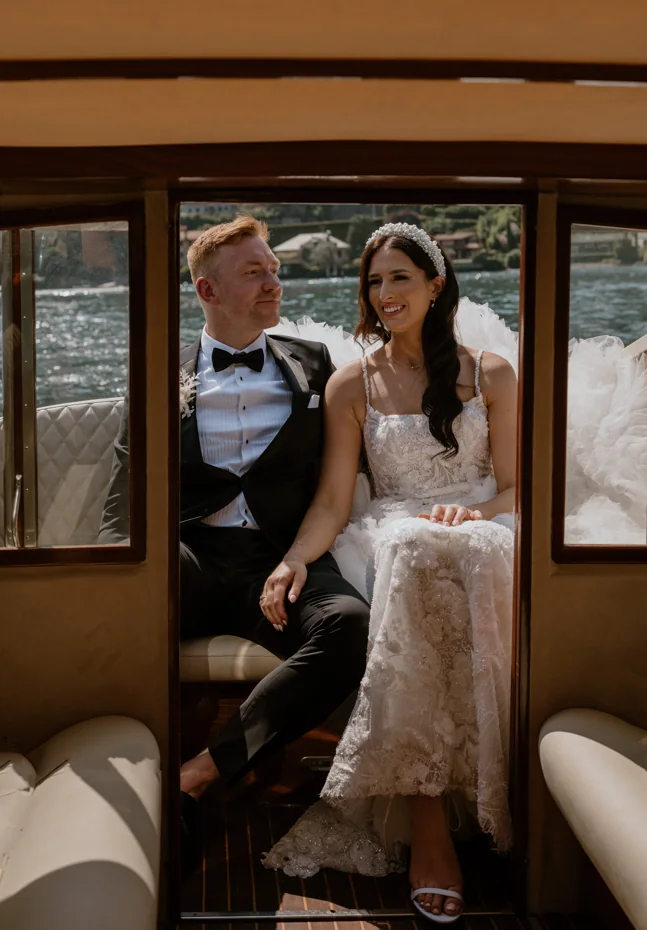 Bride and groom travelling by boat